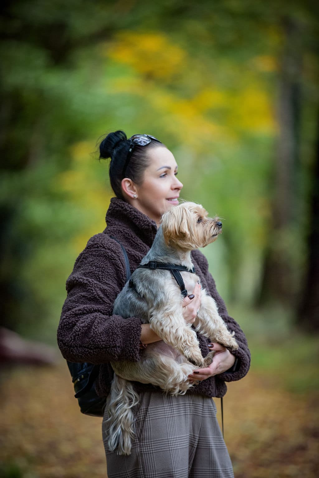 Woman with dog in autumn park