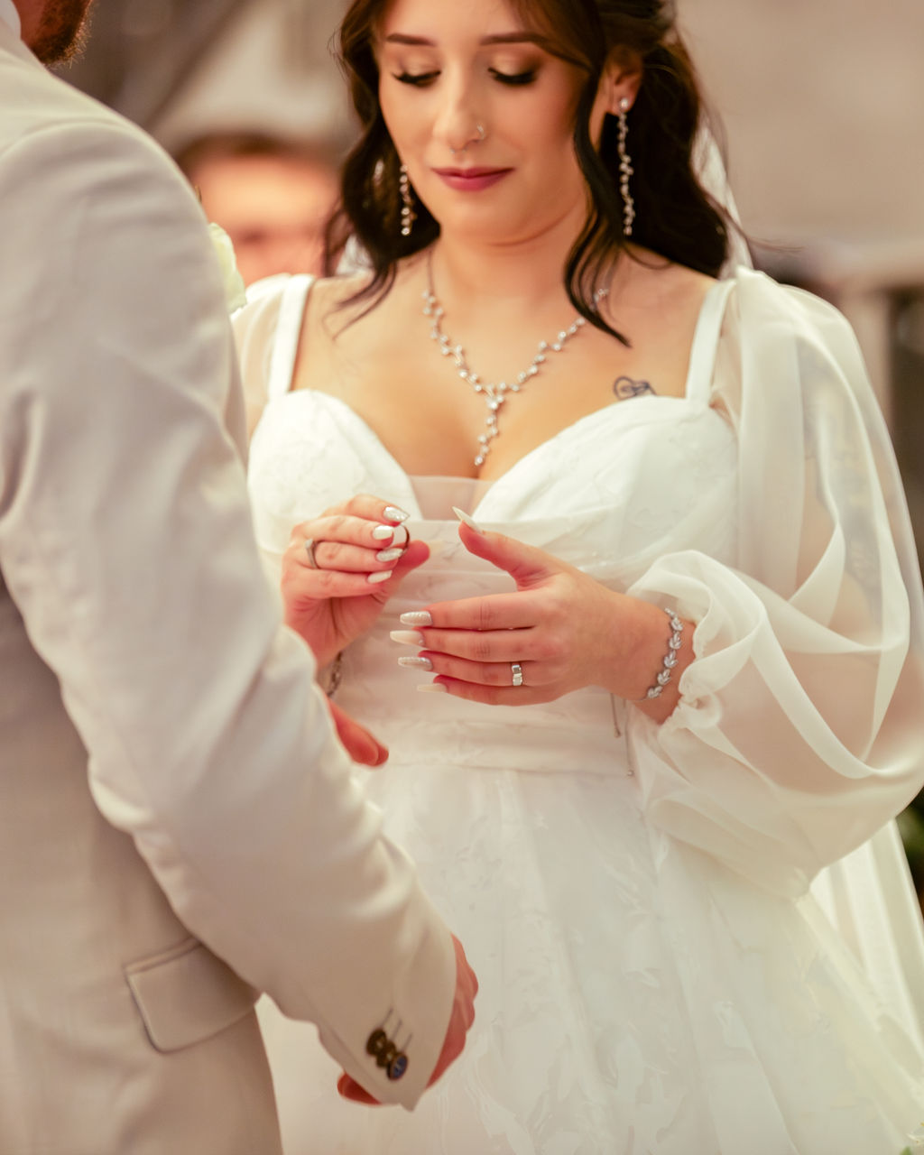 Ring exchange close-up at ceremony