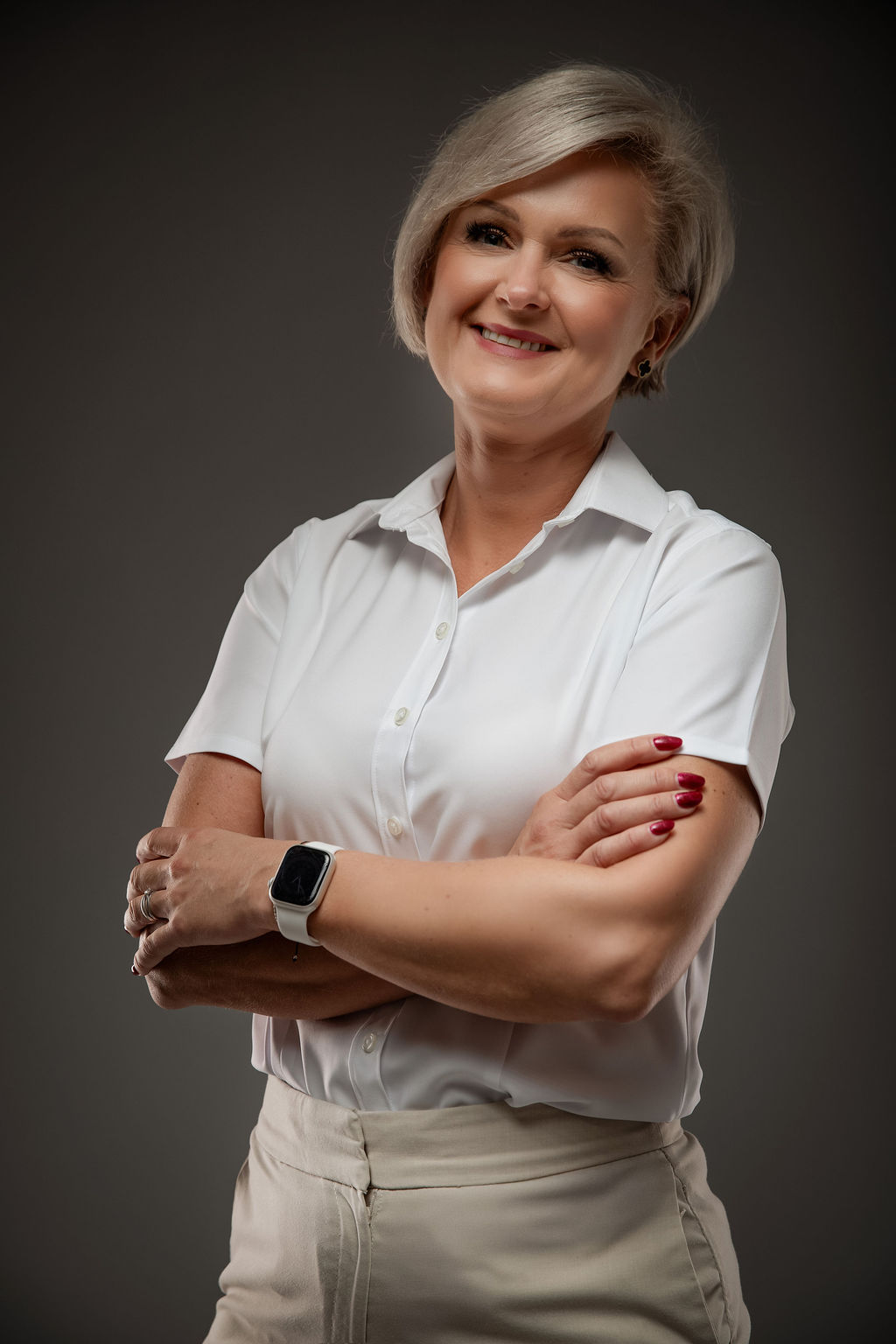 Professional headshot in white blouse